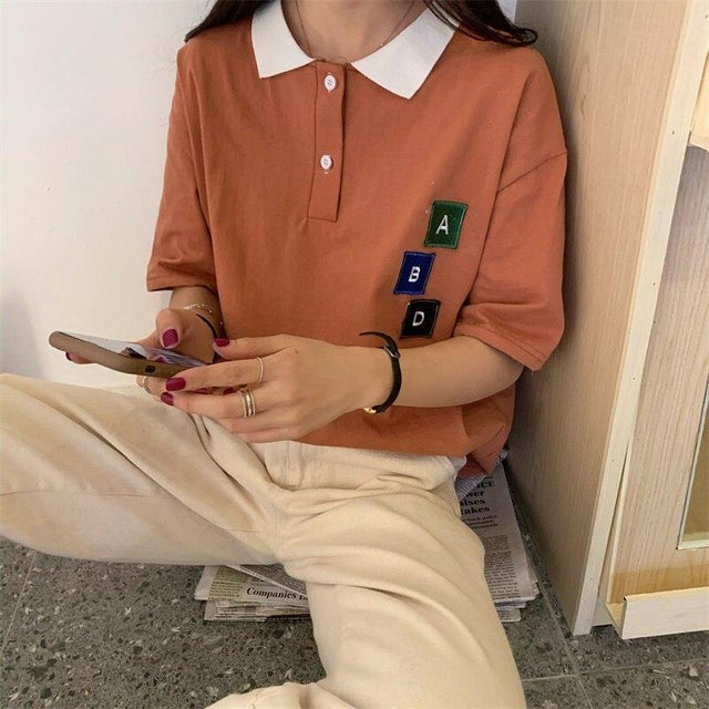 Damen-Poloshirt mit Patches-Bombardina.de